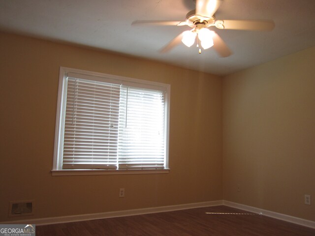 unfurnished room featuring hardwood / wood-style floors and ceiling fan