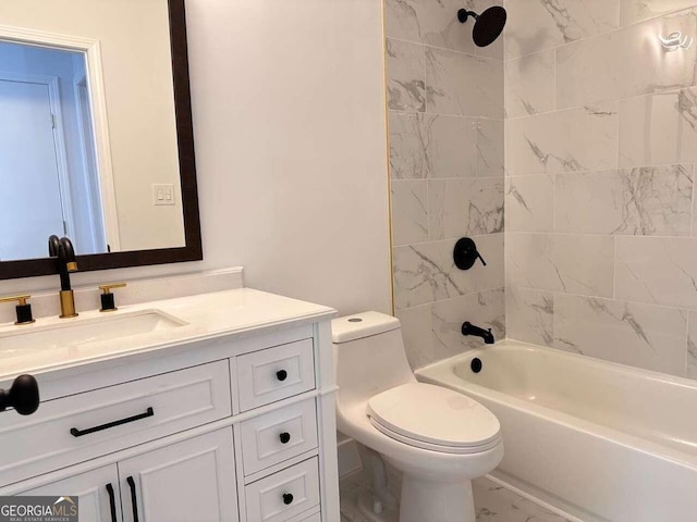 full bathroom with tiled shower / bath, vanity, and toilet