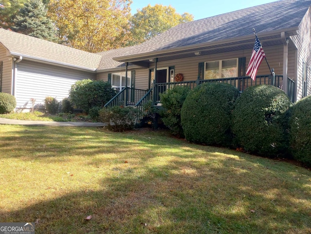 single story home featuring a porch and a front yard