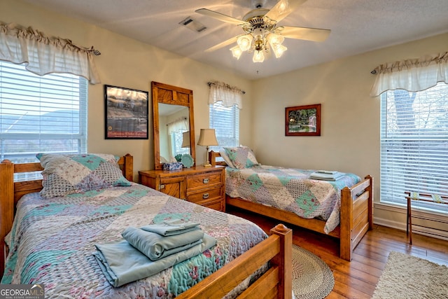 bedroom featuring ceiling fan and wood-type flooring