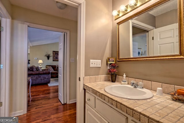 bathroom with vanity and wood-type flooring