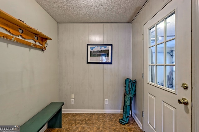 entryway with a textured ceiling