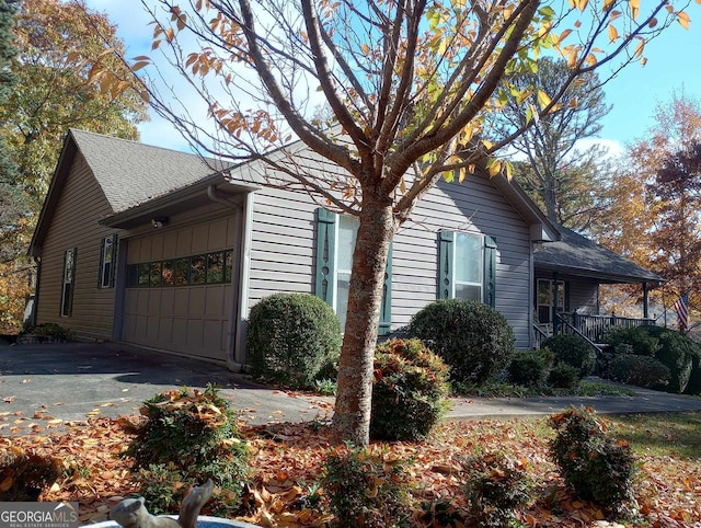 view of side of property with a garage