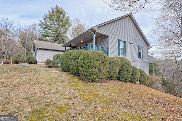 view of home's exterior featuring a yard