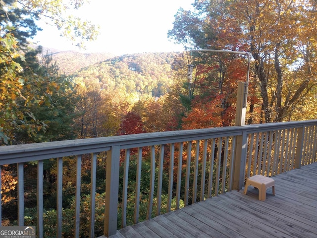 wooden terrace with a mountain view