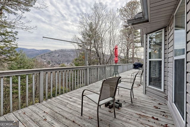 wooden terrace featuring a mountain view