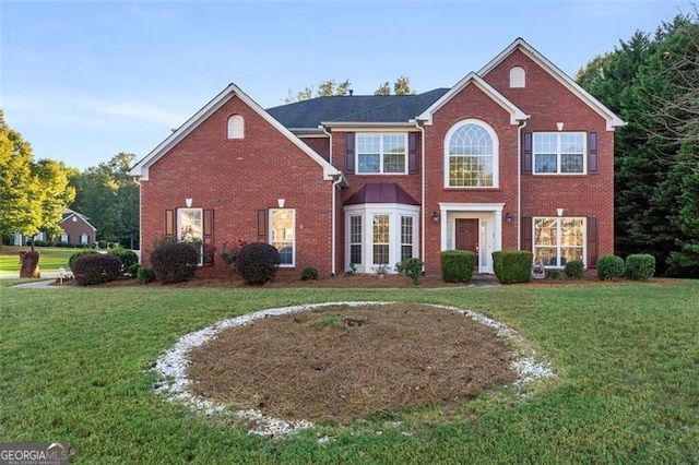 view of front of home with a front lawn