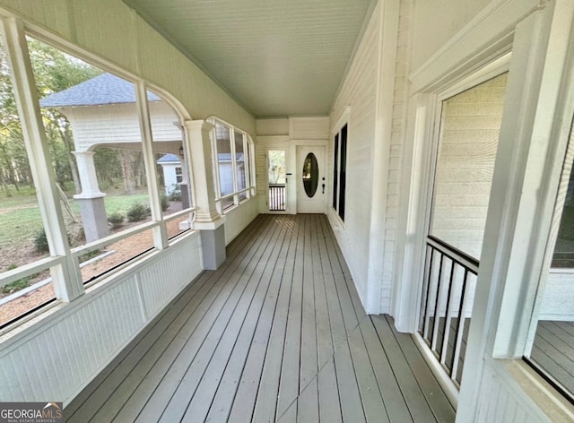 unfurnished sunroom with a wealth of natural light