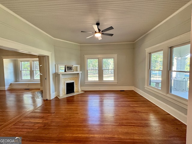 unfurnished living room with a wealth of natural light, ornamental molding, and dark hardwood / wood-style floors