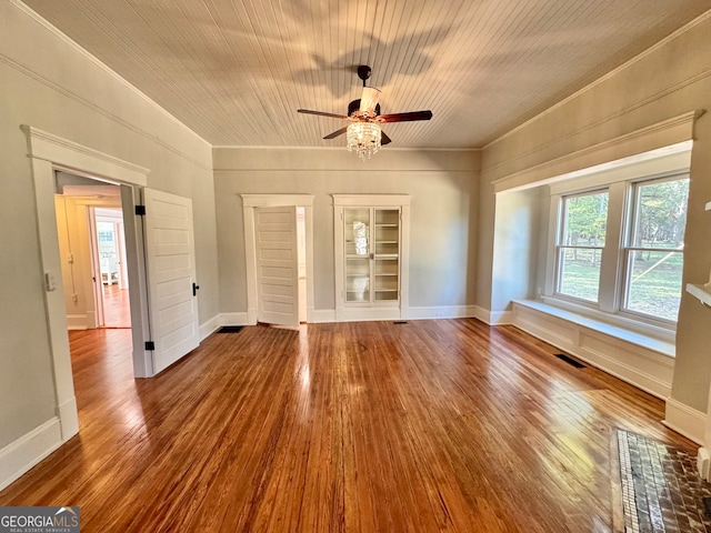 unfurnished living room featuring built in shelves, wood ceiling, wood-type flooring, and ceiling fan