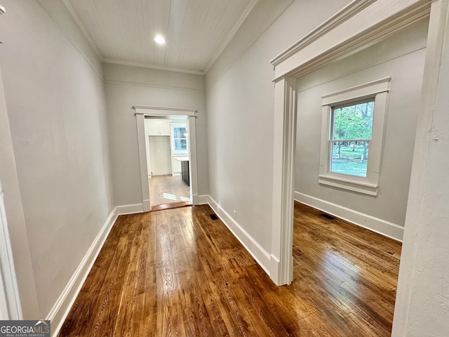 hallway with crown molding and dark wood-type flooring