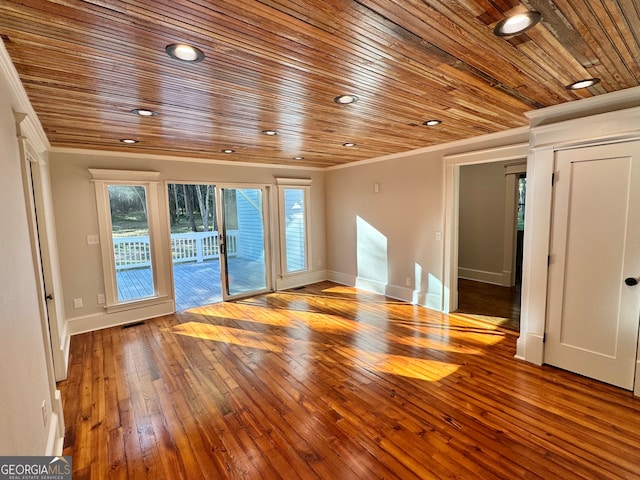 spare room with wood ceiling, wood-type flooring, and ornamental molding