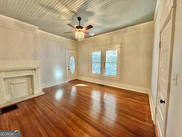 unfurnished living room with wood ceiling, wood-type flooring, and ceiling fan