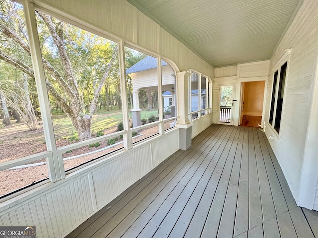 unfurnished sunroom with plenty of natural light