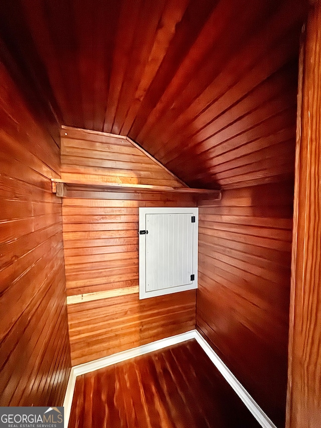 view of sauna with wood ceiling, wood walls, and hardwood / wood-style floors