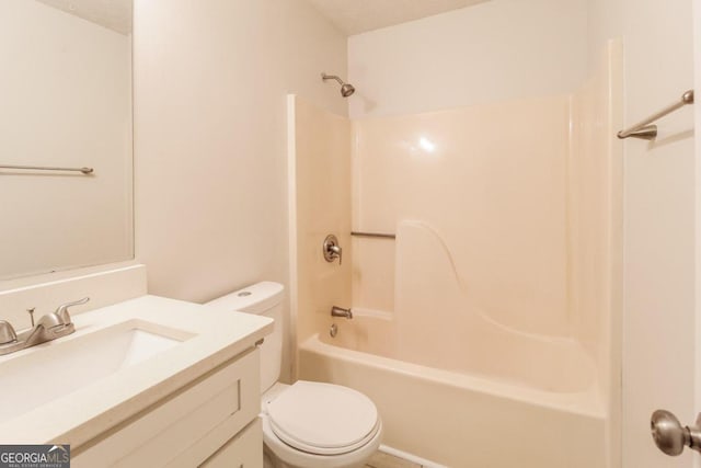 full bathroom with vanity, toilet, shower / bathing tub combination, and a textured ceiling