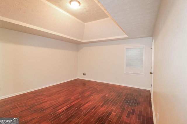 bonus room featuring a textured ceiling and dark hardwood / wood-style flooring