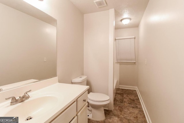 full bath featuring visible vents, a textured ceiling, toilet, and vanity