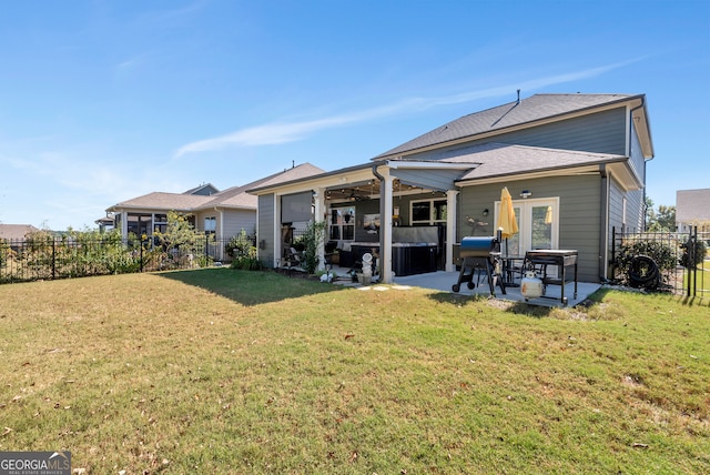 back of house with a patio area, ceiling fan, and a yard