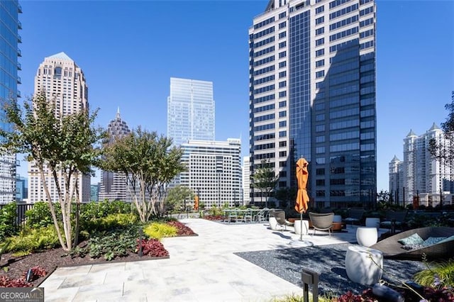 1080 Peachtree St NE Unit 1408, Atlanta, GA 30309 - surrounding community featuring a view of skyline and a patio area