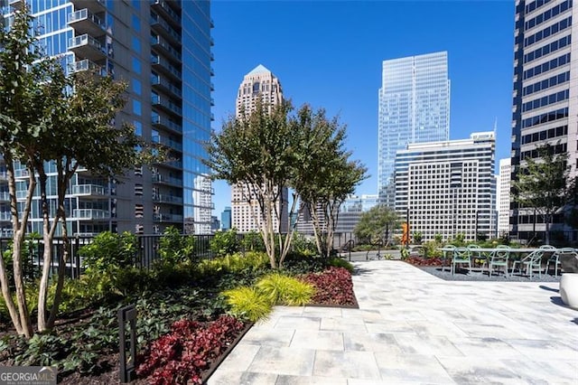 surrounding community with a patio area