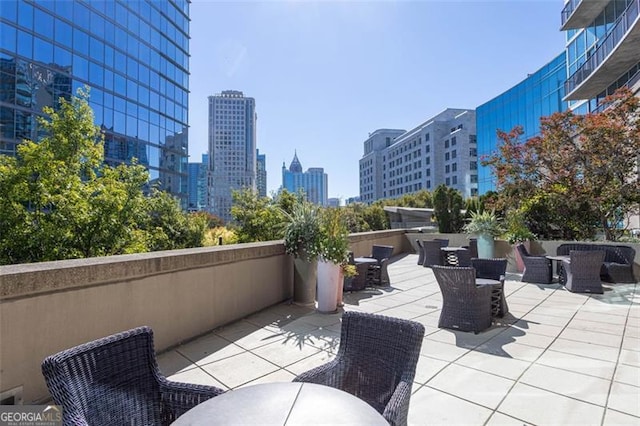 1080 Peachtree St NE Unit 1408, Atlanta, GA 30309 - view of patio / terrace featuring a skyline view
