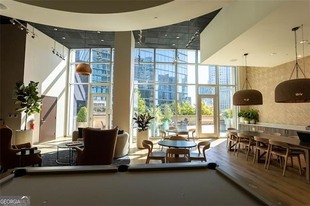 1080 Peachtree St NE Unit 1408, Atlanta, GA 30309 - community lobby with a wall of windows, a high ceiling, and a view of city