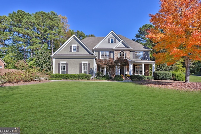 view of front of home featuring a porch and a front yard