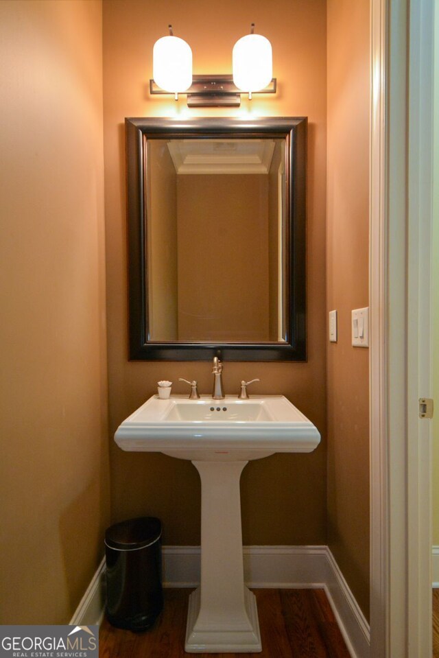 bathroom featuring sink and hardwood / wood-style floors