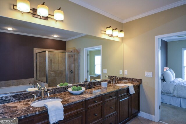 bathroom featuring vanity, crown molding, and shower with separate bathtub