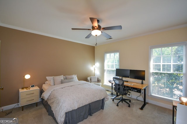 carpeted bedroom with ceiling fan and crown molding