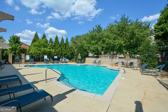 view of pool featuring a patio