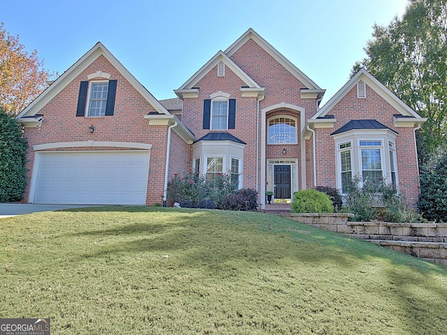 view of property featuring a garage and a front yard