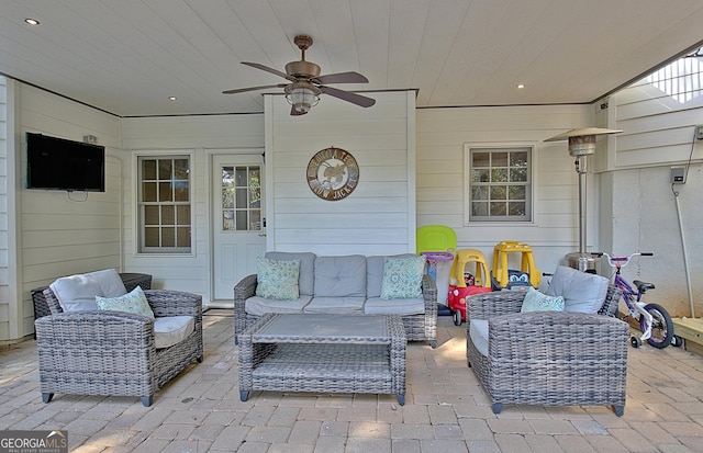 view of patio featuring outdoor lounge area and ceiling fan