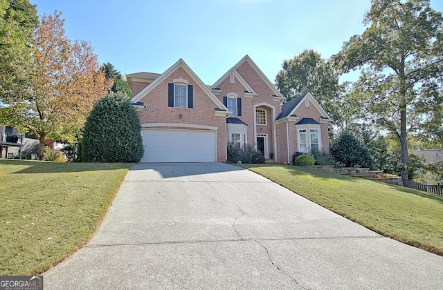 view of front facade with a garage and a front yard