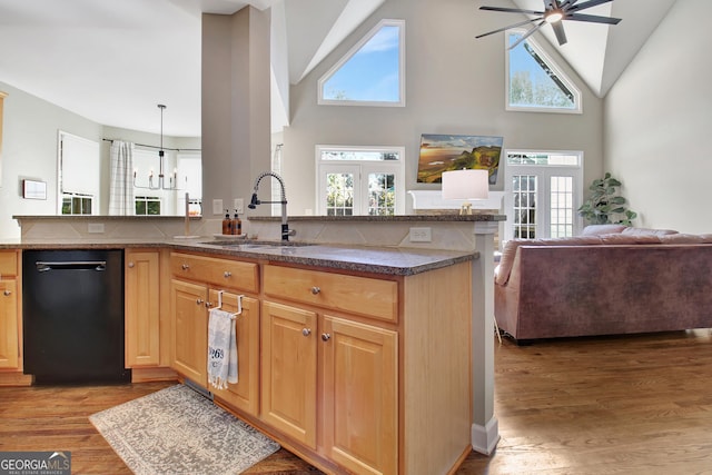 kitchen with dishwasher, french doors, sink, hanging light fixtures, and light wood-type flooring