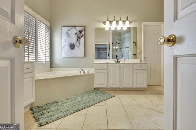 bathroom featuring tile patterned flooring, vanity, and separate shower and tub