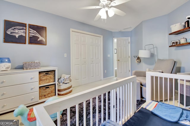 bedroom featuring ceiling fan and a closet