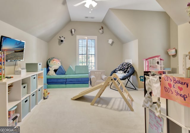 recreation room featuring carpet floors, ceiling fan, and lofted ceiling