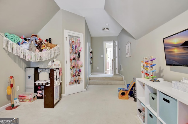 recreation room with light colored carpet