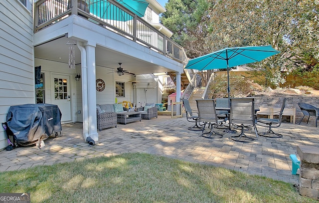 view of patio with grilling area, ceiling fan, a balcony, and an outdoor hangout area