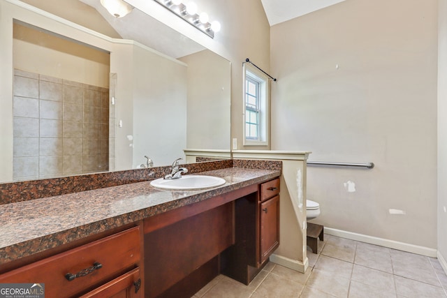 bathroom featuring toilet, tile patterned flooring, and vanity