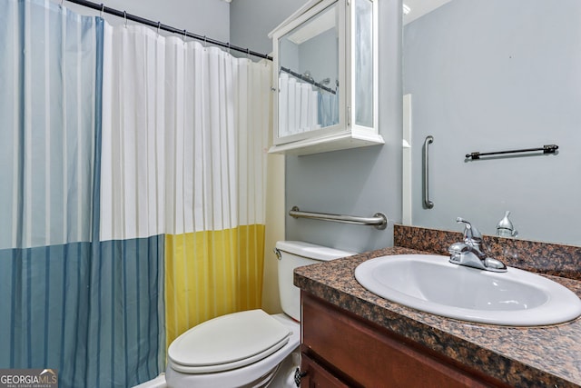 bathroom with toilet and vanity