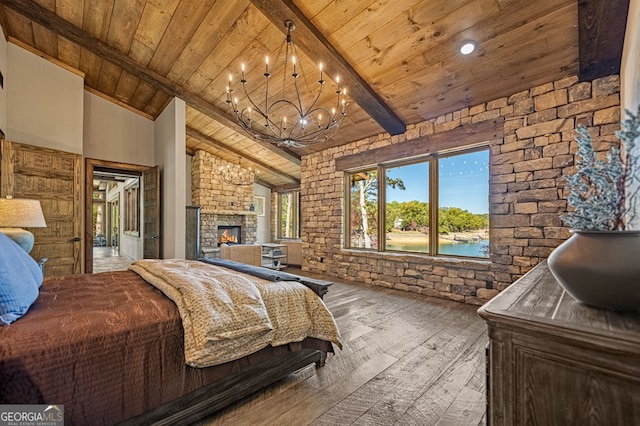 bedroom featuring a notable chandelier, hardwood / wood-style floors, beam ceiling, and wooden ceiling