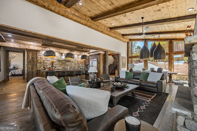 living room with wooden ceiling, beamed ceiling, and dark hardwood / wood-style floors