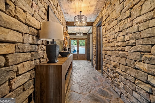 hallway featuring french doors and wood ceiling