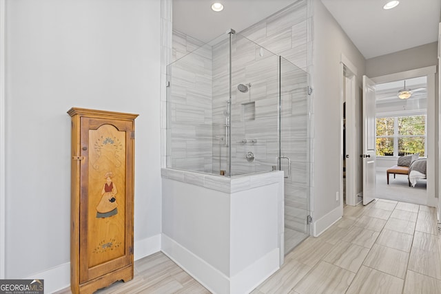 full bathroom featuring recessed lighting, a shower stall, and baseboards