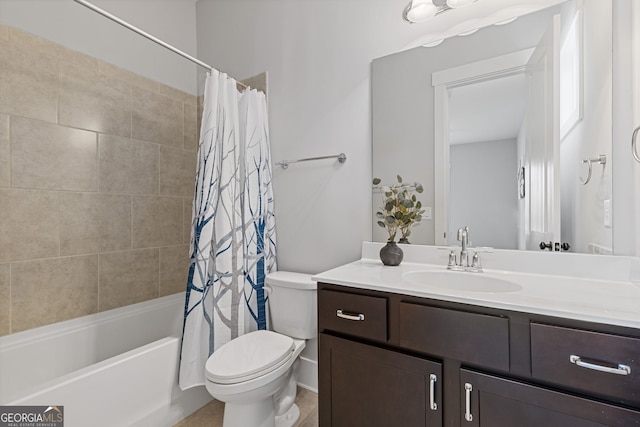 bathroom featuring shower / tub combo, vanity, and toilet