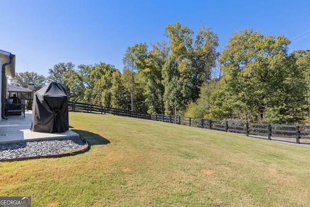 view of yard with a patio and fence