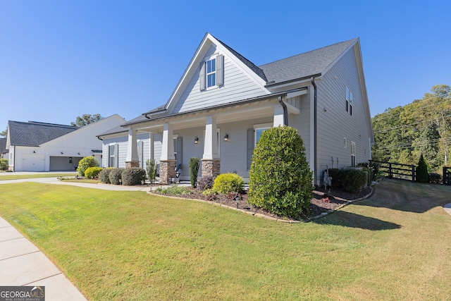 view of front facade with a front yard and fence